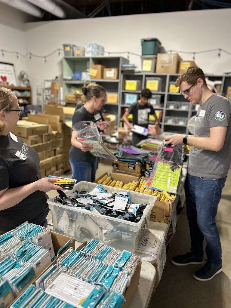 Employees packing school supplies